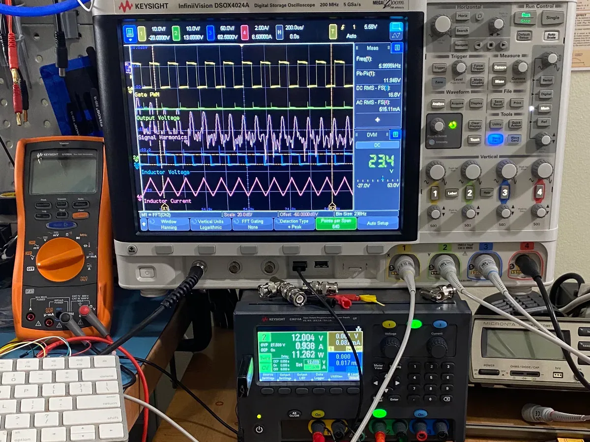 Digital multimeter, live oscilloscope waveforms, and DC power supply connected with test leads on an electrical workbench