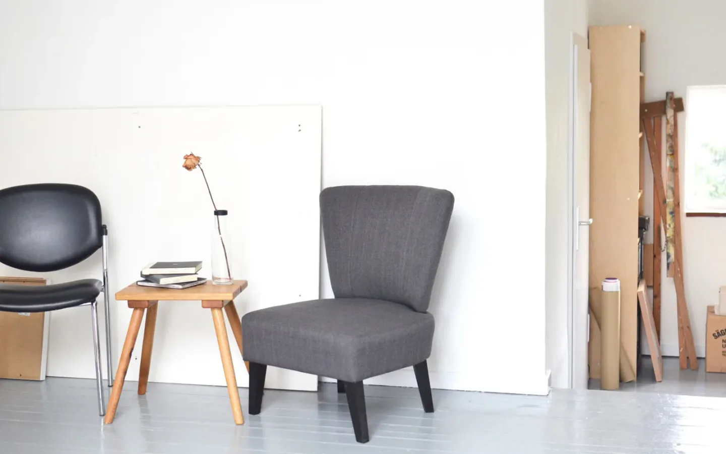 Commercial wooden dining tables and chairs arranged in a modern hospitality furniture space